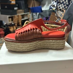 Ulla Johnson Valencia twisted contrast flat form color is called chili